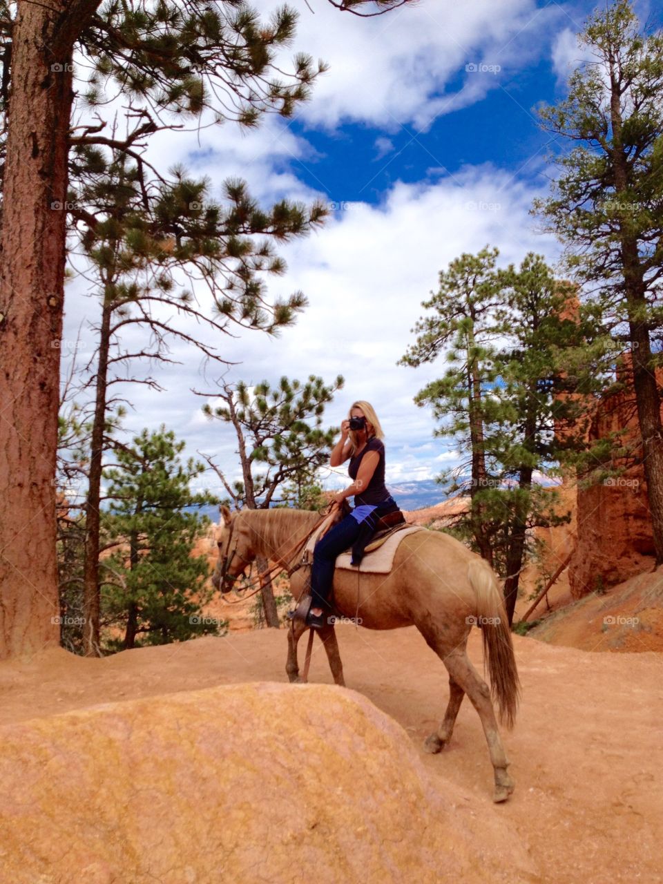 Horseback Riding Photographer. While horseback riding through Bruce Canyon a camera is a must...no matter how difficult!