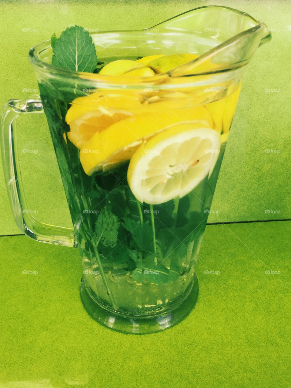 yellow lemons in water with mint