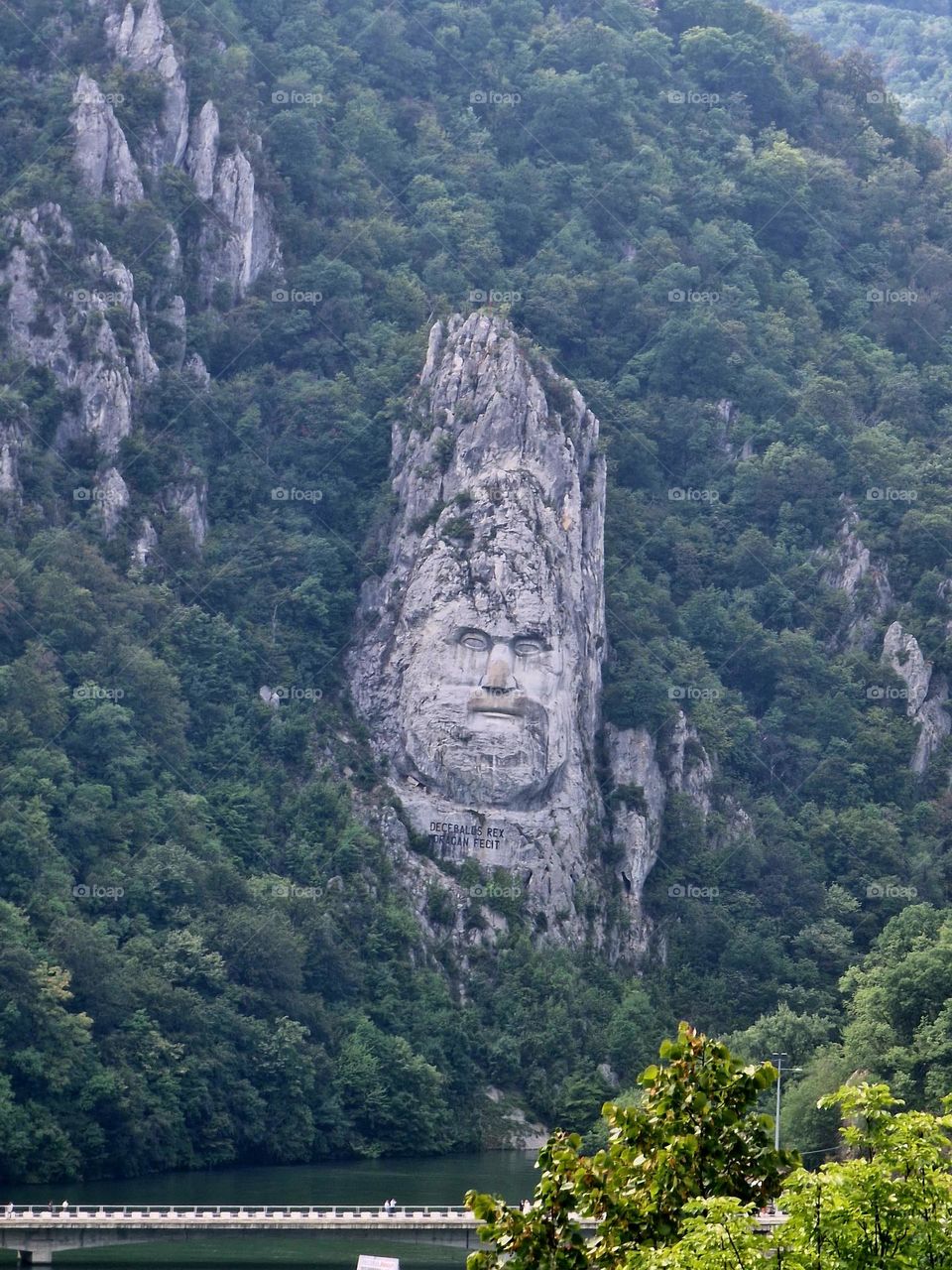 the sculpture of the face of the Decebal Dacian king, seen from the Serbian bank of the Danube