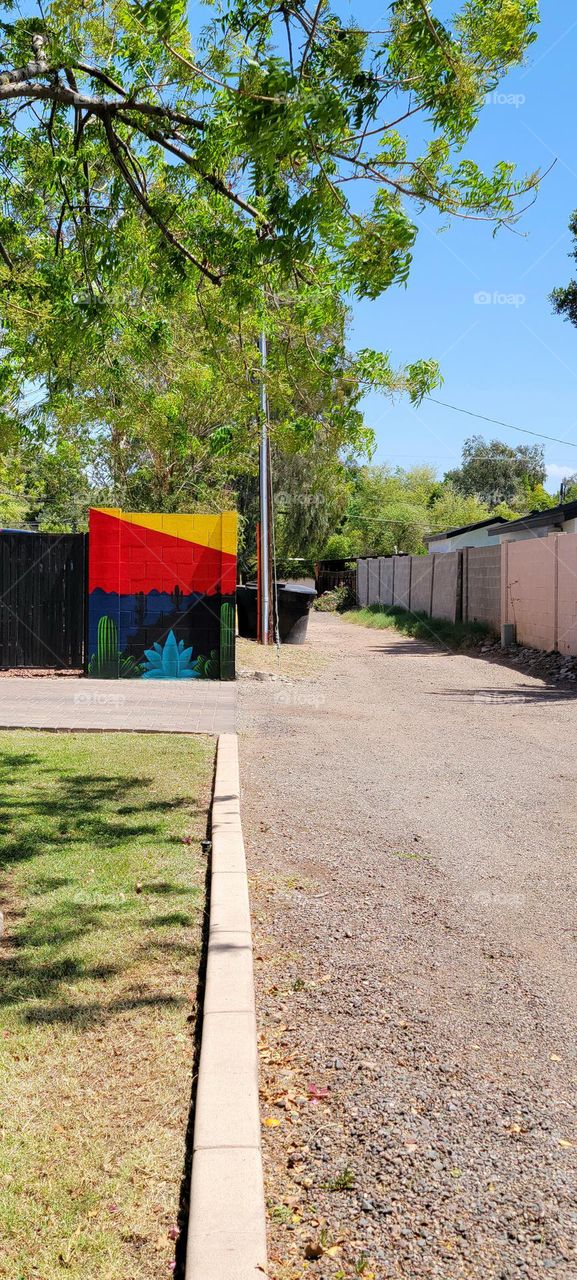 Just a small mural piece, it sat so far back you could really miss it. The cactus and colors pop.