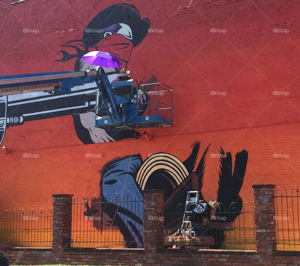 Mural painters in action