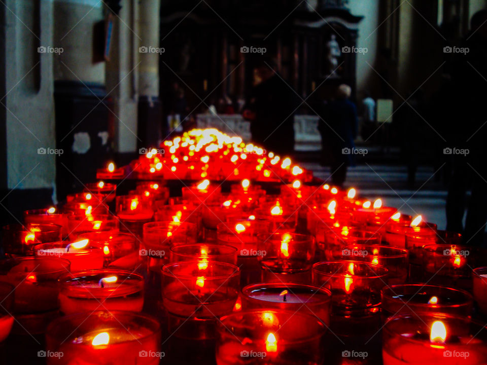 Prayer candles burning in a church in Europe