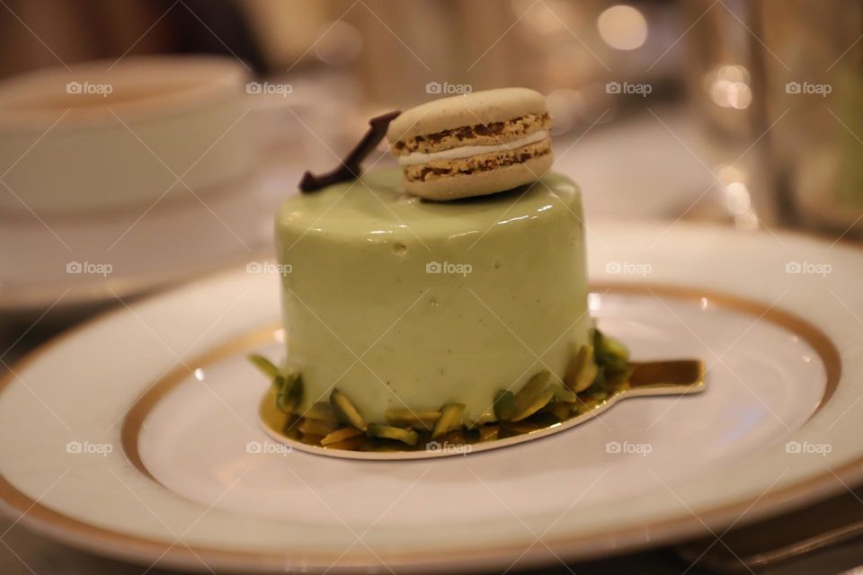 Pistachio cake with macaroon on the top