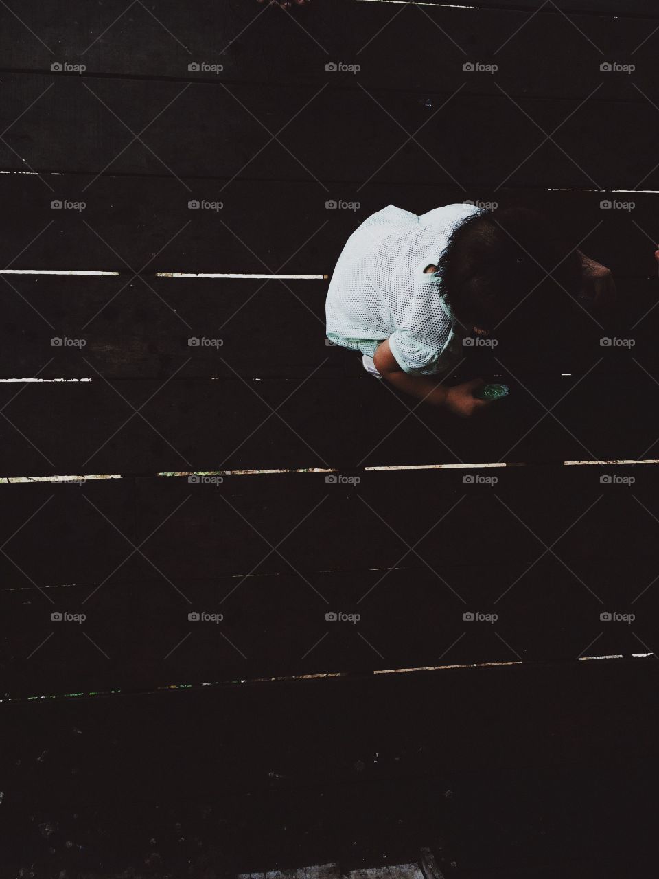 Kid on a wooden floor