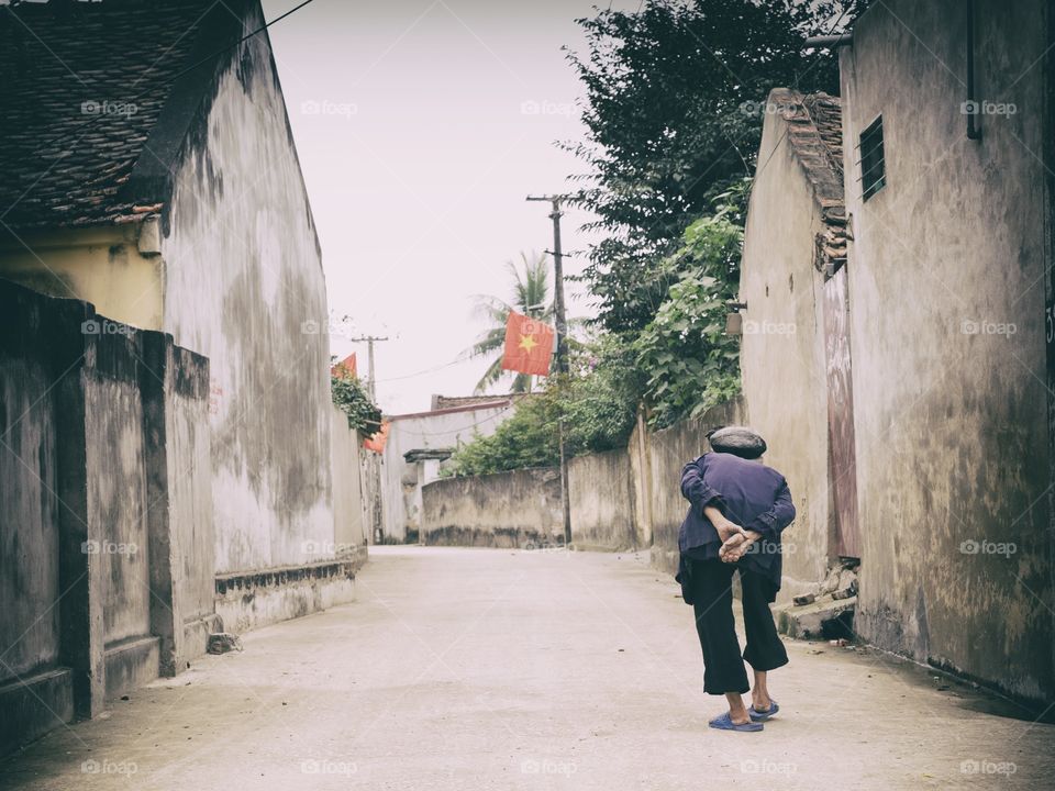 Elderly walking in Thanh Hoa, Vietnam. 22 February 2015