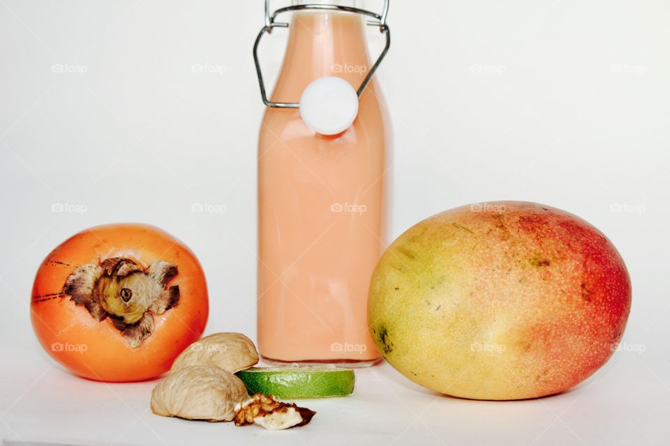 Kaki , mango , lime and a smothie 