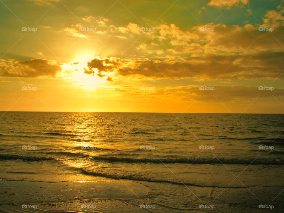 beach yellow sunrise sea by evelia