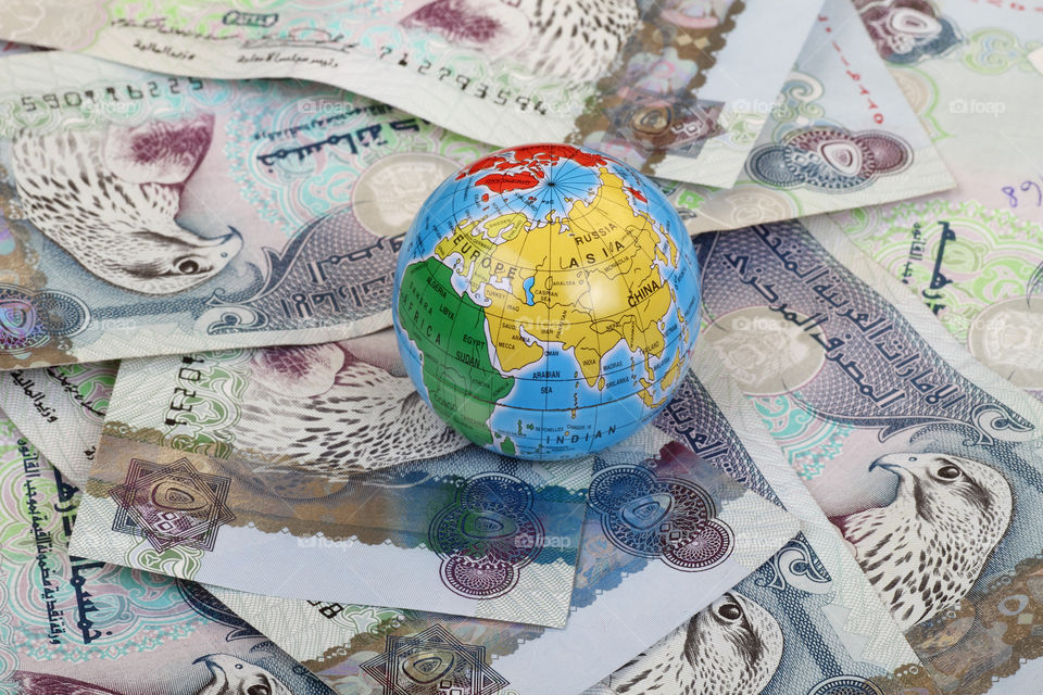 Globe and UAE United Arab Emirates dirham currency notes