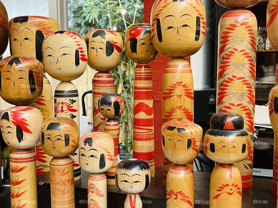 Assorted wood kokeshi dolls, engraved typical Japanese dolls, Japanese crafts, Japanese art and tradition 