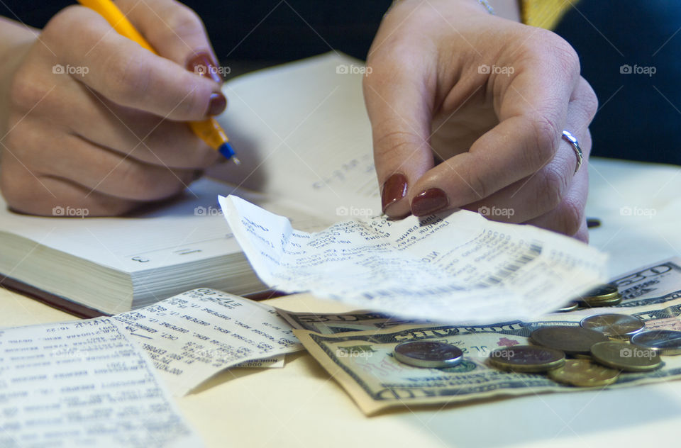 woman takes notes in notepad and says Finance