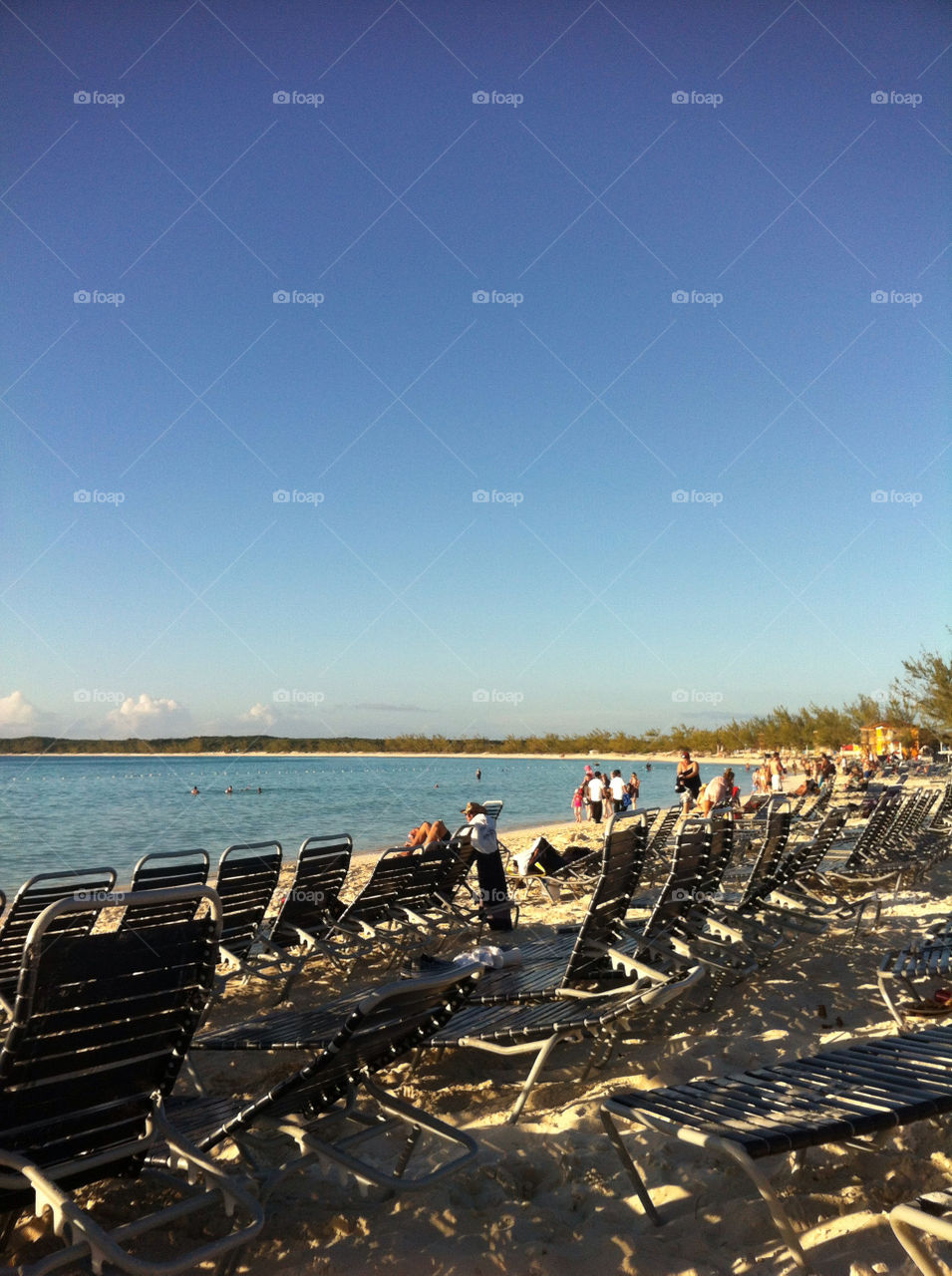 Many chairs on a beach in the Caribbean.