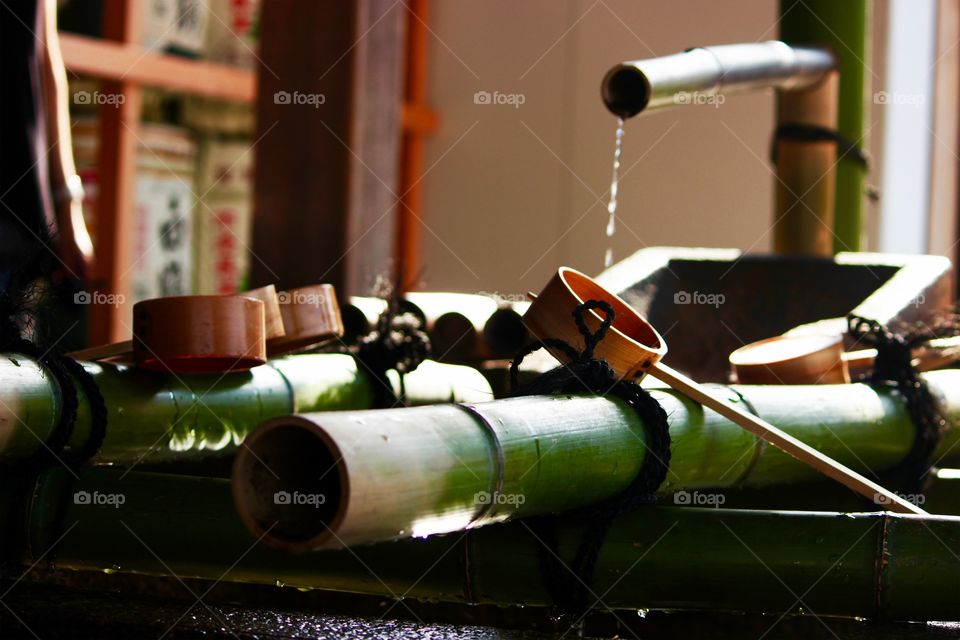 The water rinse from bamboo pipe of holy temple in japan for people or travel. Who 
Believe or faith in god to prey for good things
In religion.