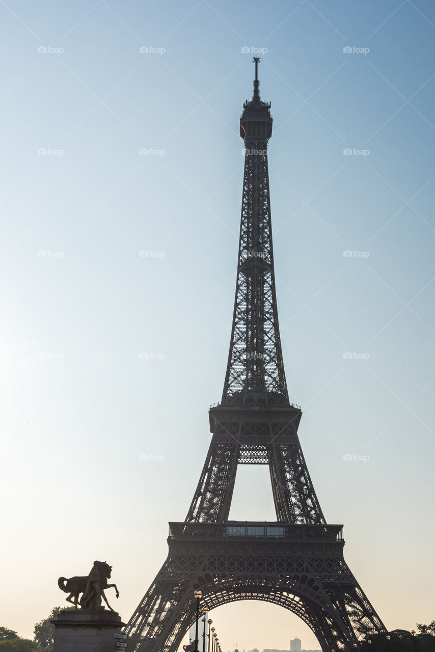 Morning sunrise backlight on the Eiffel Tower in Paris 