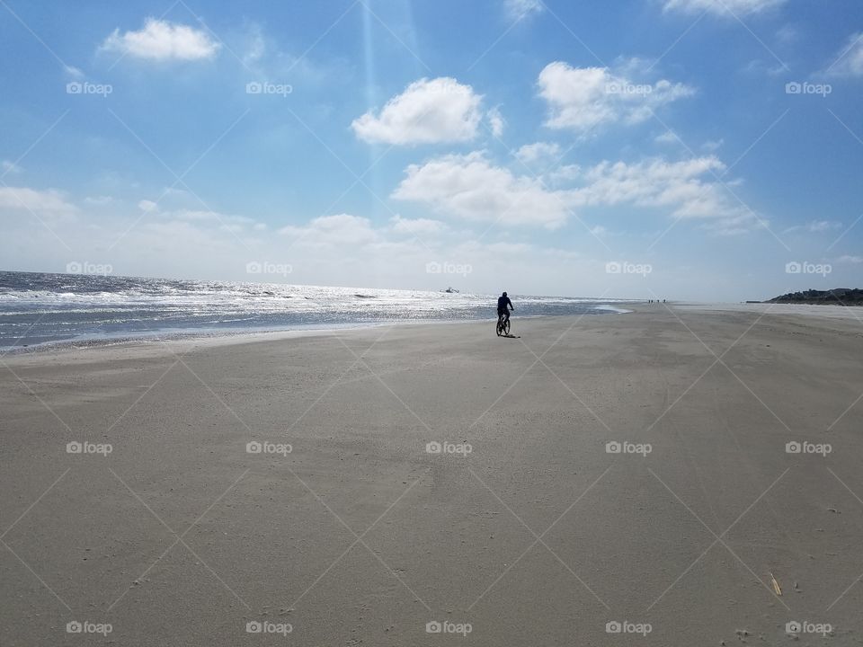 riding bike on the beach