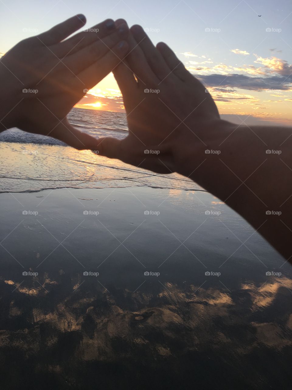 Sunset between hands 