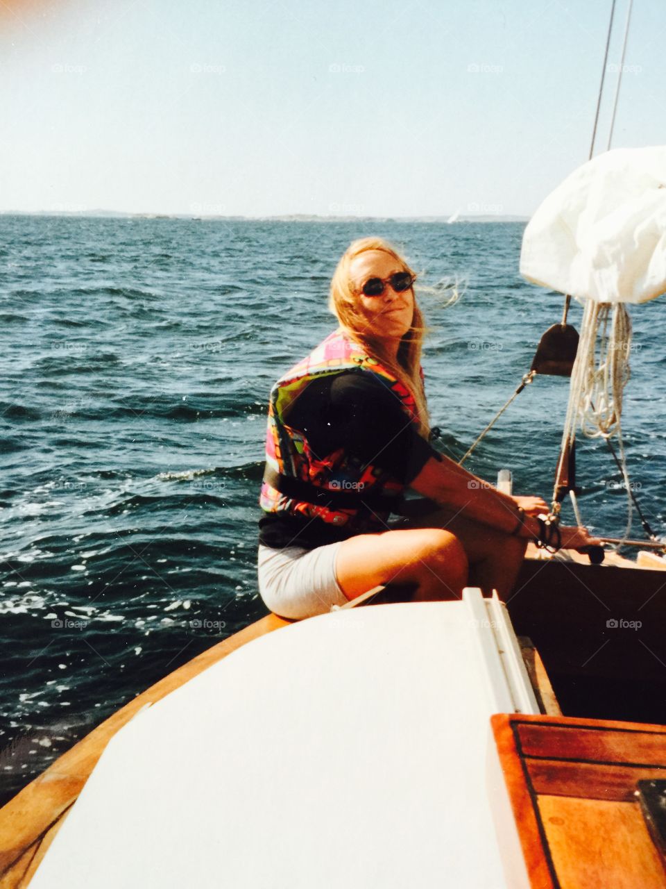 Let's go sailing. Girl trying to sail a small boat