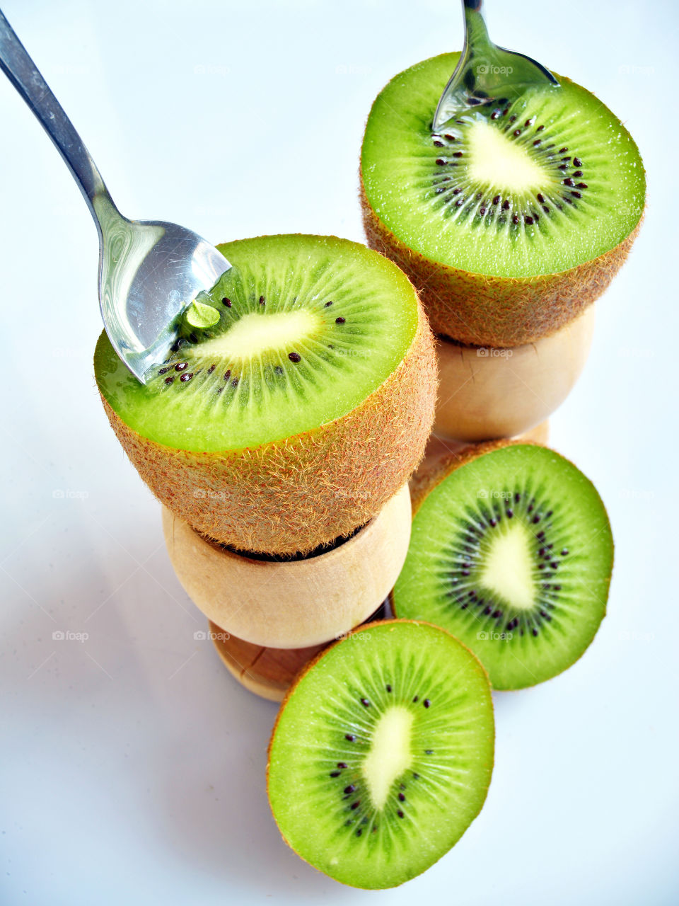 Kiwi fruits against white background