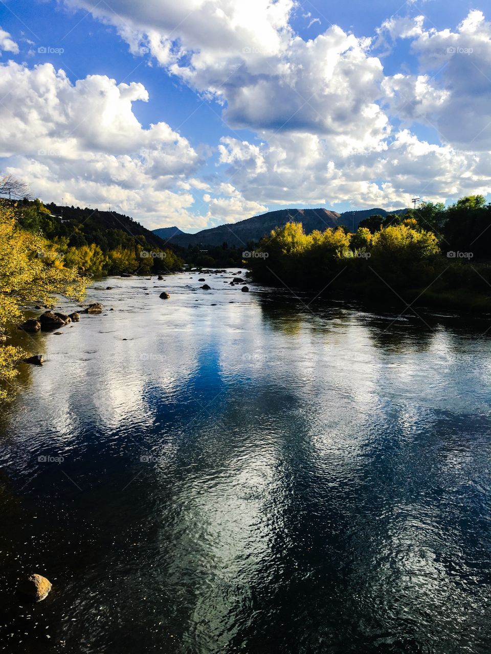 Clouds reflected in river