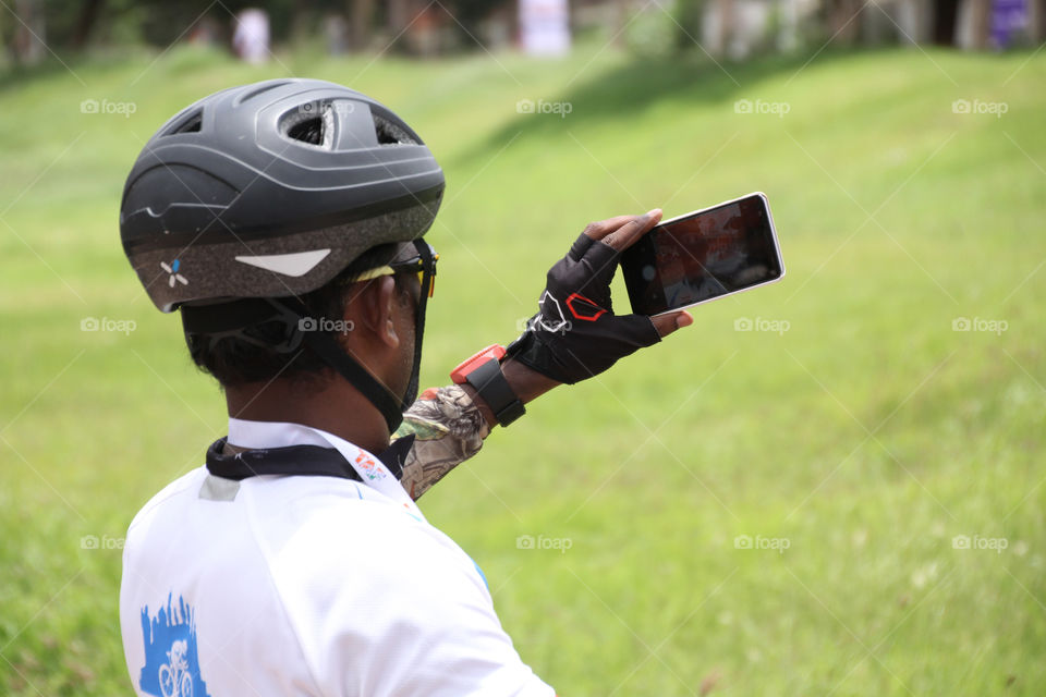 Cyclists taking selfie, sports man