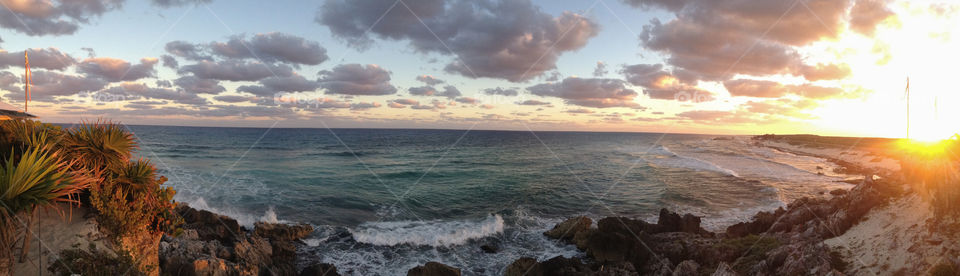 Panoramic view of idyllic sea with dramatic sky