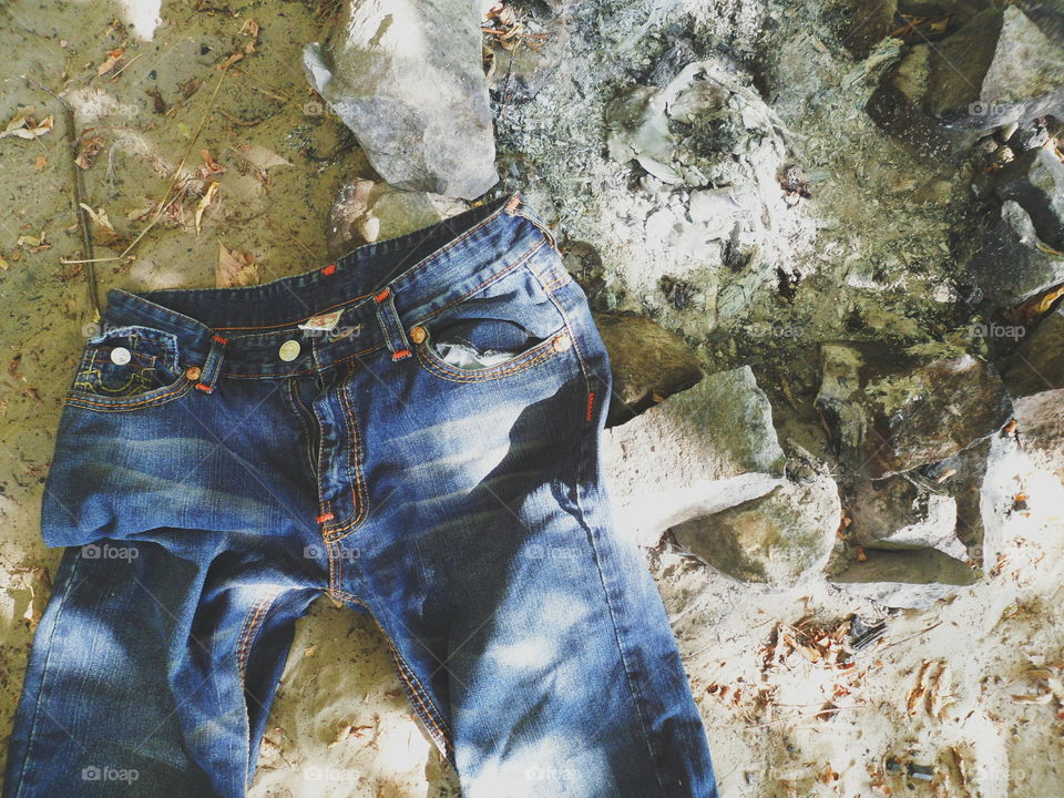 jeans lie near the extinct fire