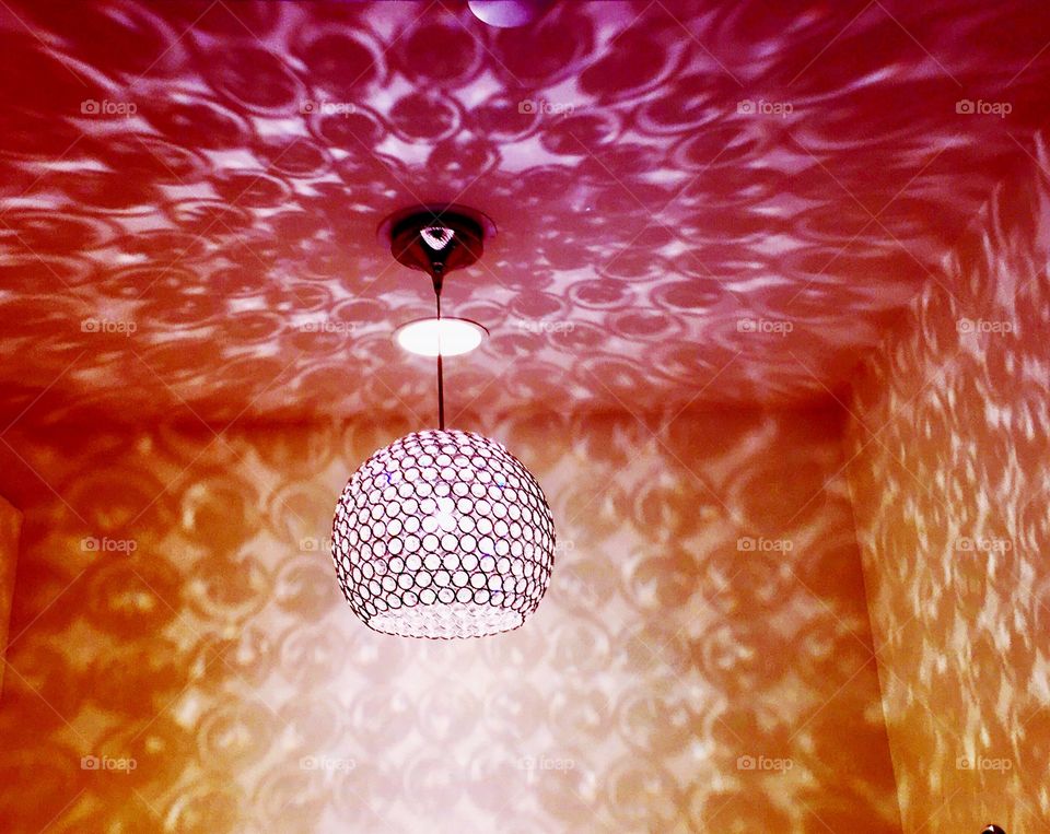 Pink Sparkling chandelier in femme fatale dressing closet