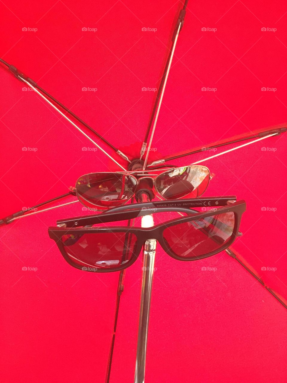red umbrella with glasses 