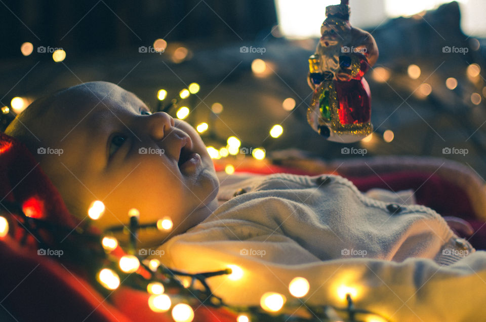 Christmas lights near baby