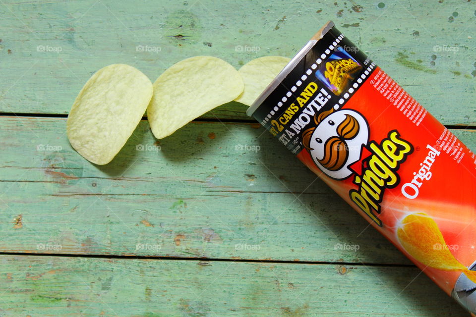 Pringles chips on a wooden table