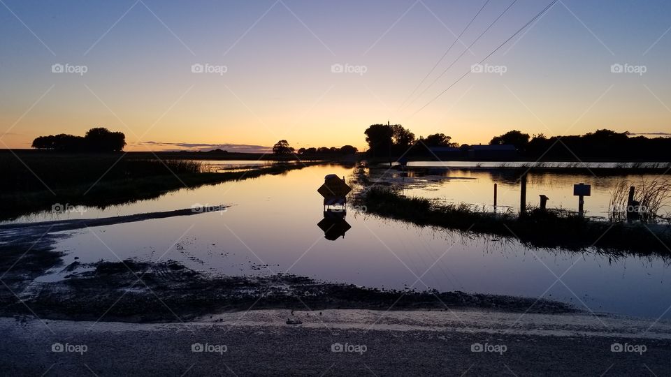 flooded road sunset