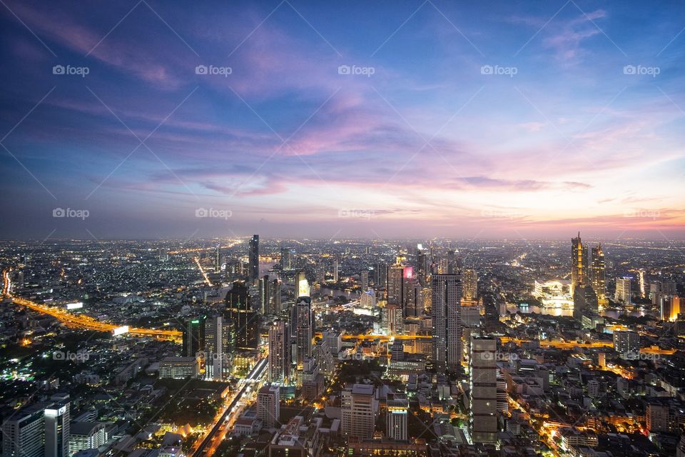 Beautiful twilight sky over capital city scape in Summer, photo from Sky roof Mahanakorn building