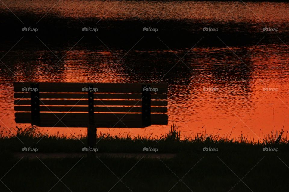 A park bench at sunset 