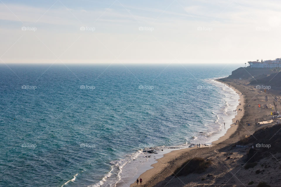 Beautiful ocean with sandy beach along the coast 
