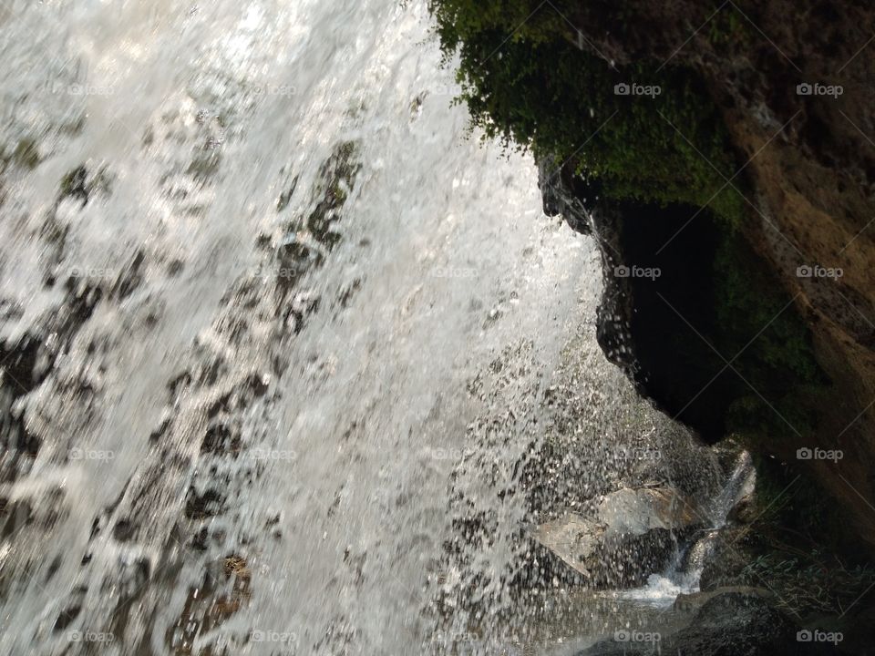 The view from beneath the waterfalls with swift currents ,image of water movement.