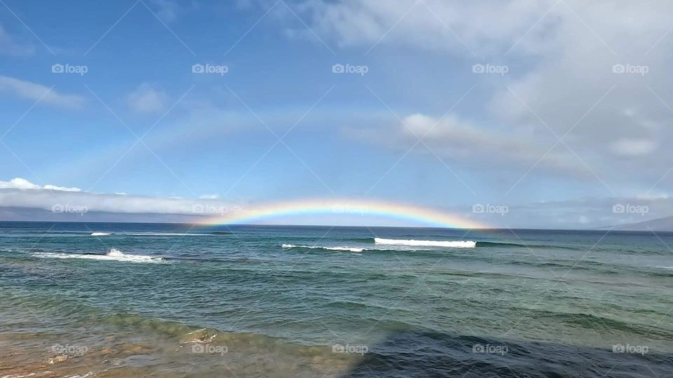 Rainbow over ocean in Hawaii Maui 