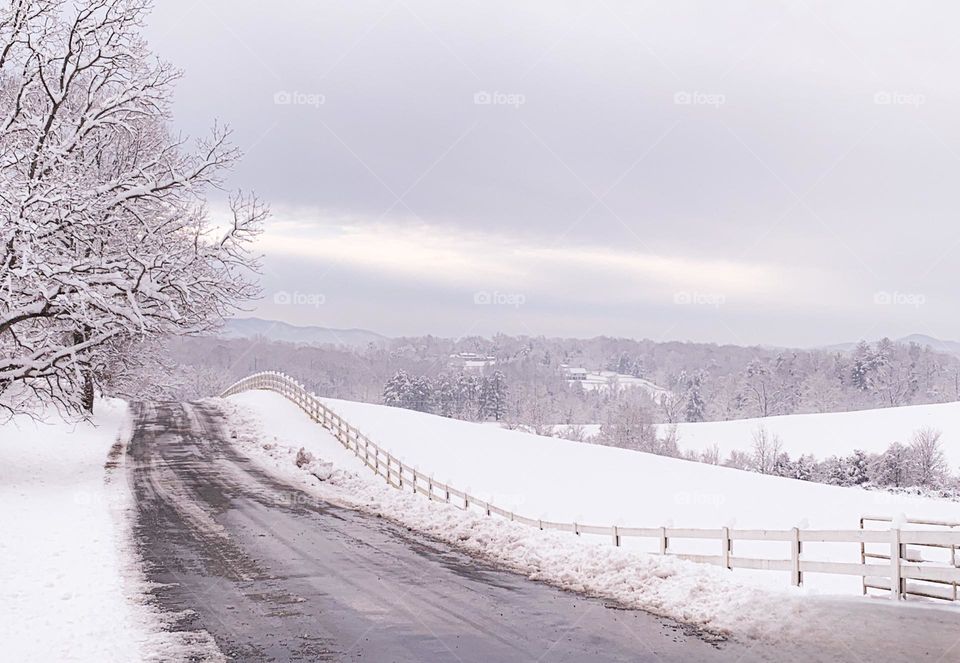 Winter is way better then fall because you get to see this. Not much to think about. The way the mountains make the back drop,to the freshly covered trees, the fields of untouched snow as the sun is fighting to get through the thick stormy clouds. 