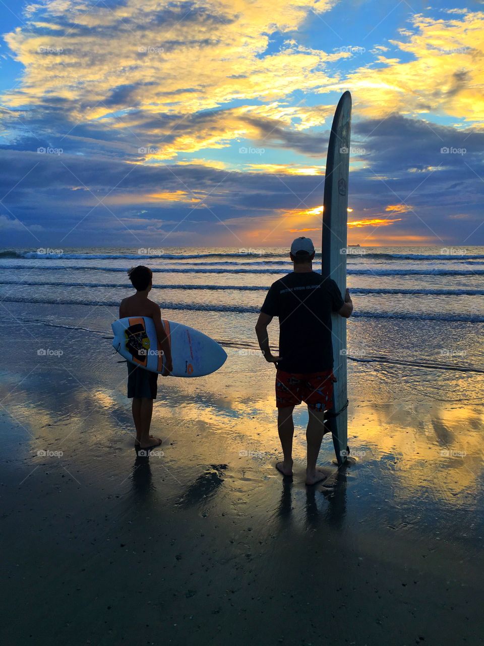 Father and son surfers
