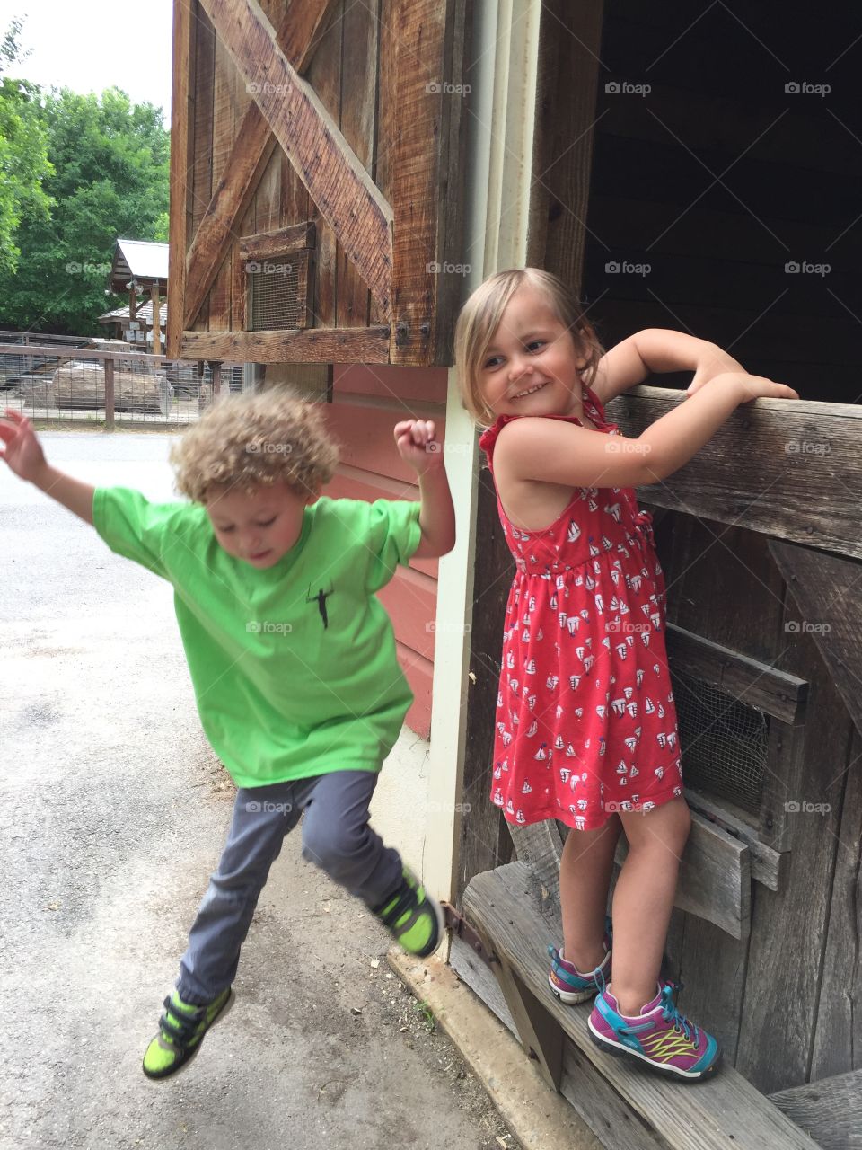 Kids Playing at a Barn