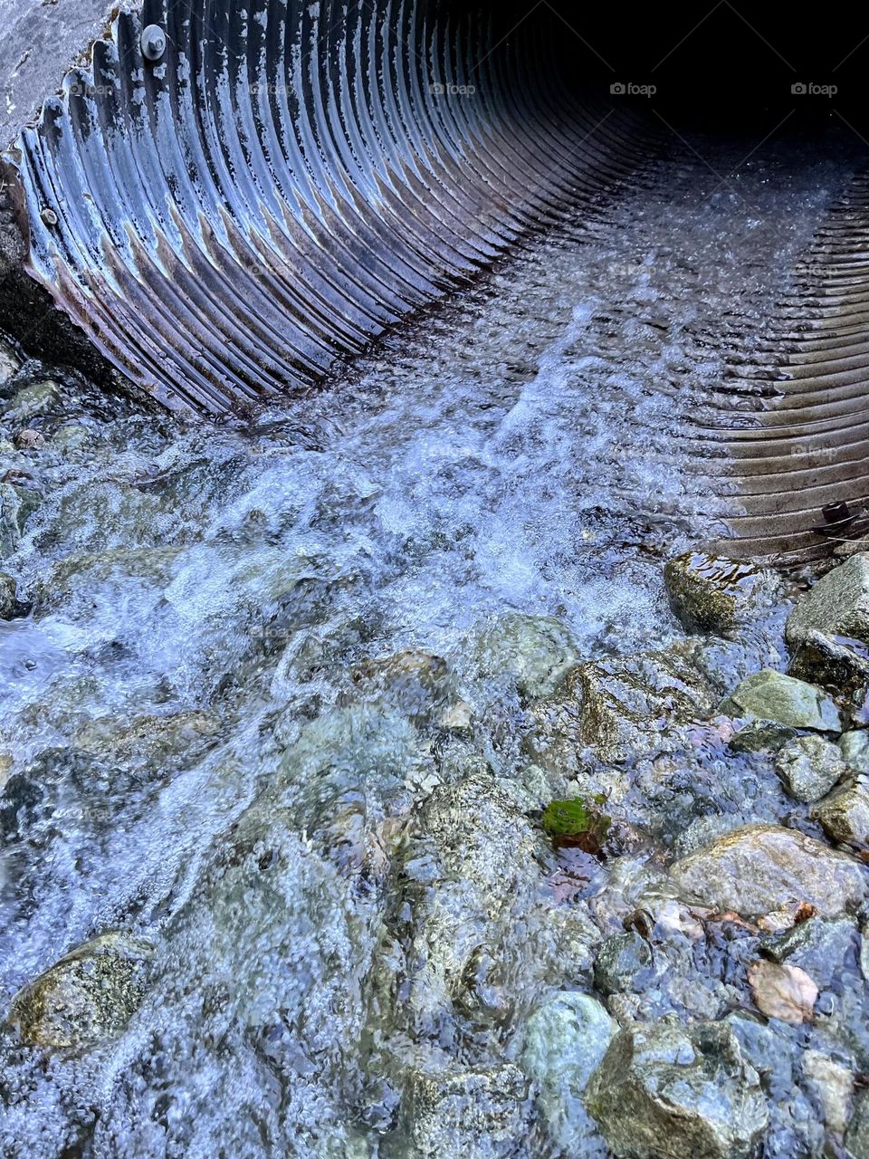 Water running through culvert 
