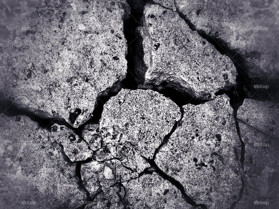 Cracked concrete slab in black and white 