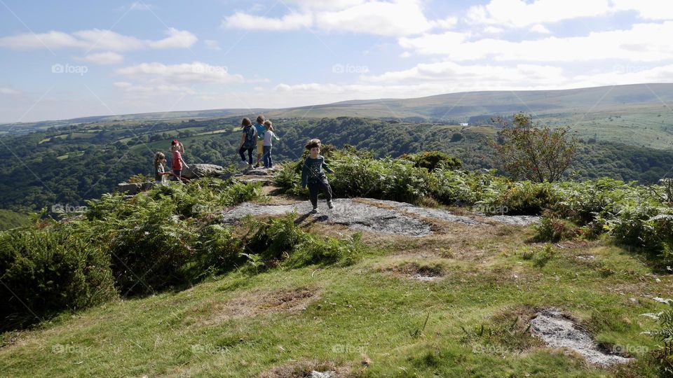 Kids running on the top of mountain 