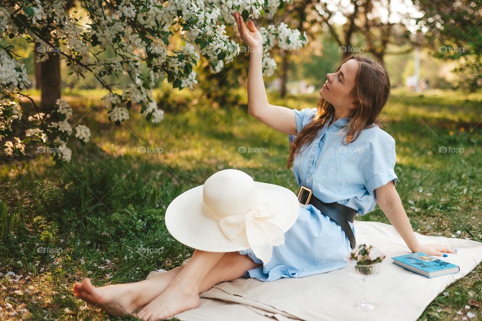 Beautiful woman on the picnic in the park 