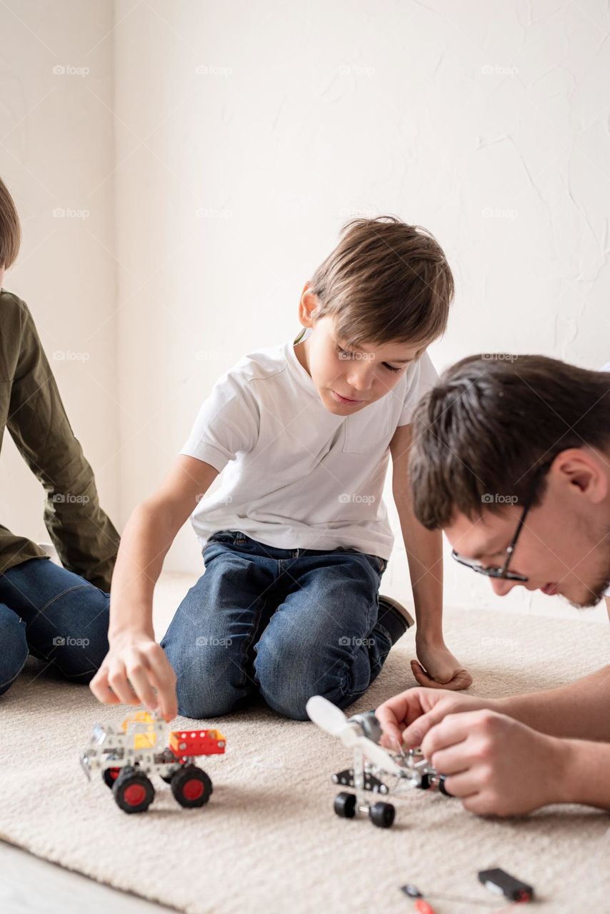 father playing games with children