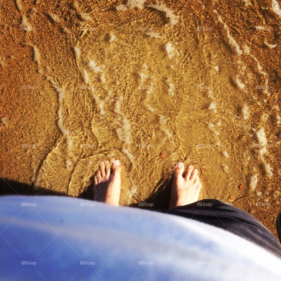 Toes in salty water

