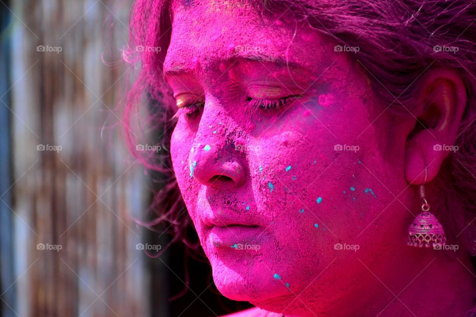 Indian woman celebrating holi festival