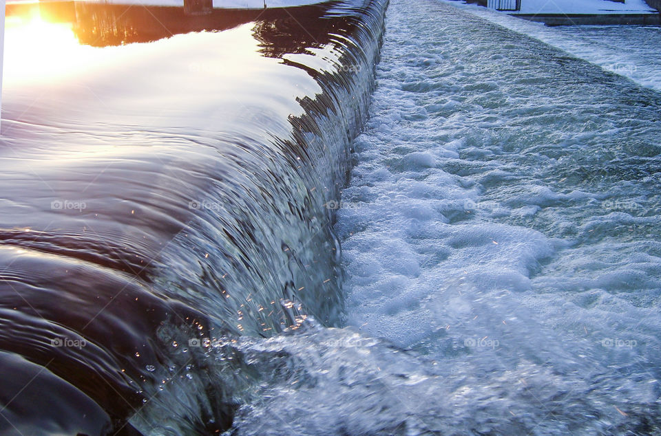 Sunlight reflected on water dam