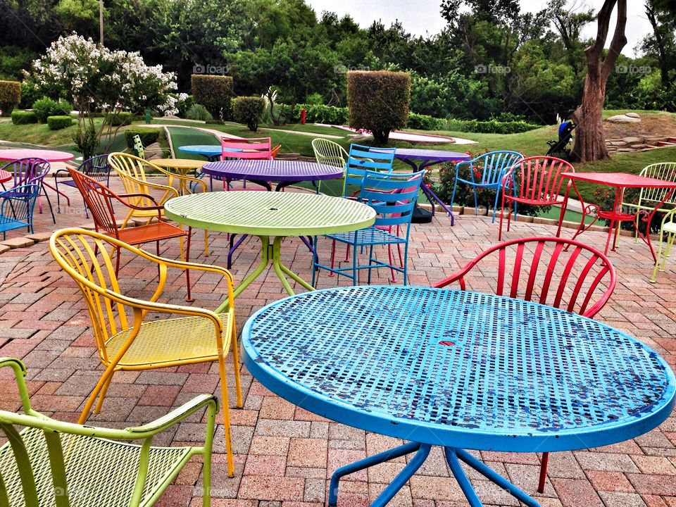 Colors of the outdoors. Colorful tables
And chairs at Top Golf