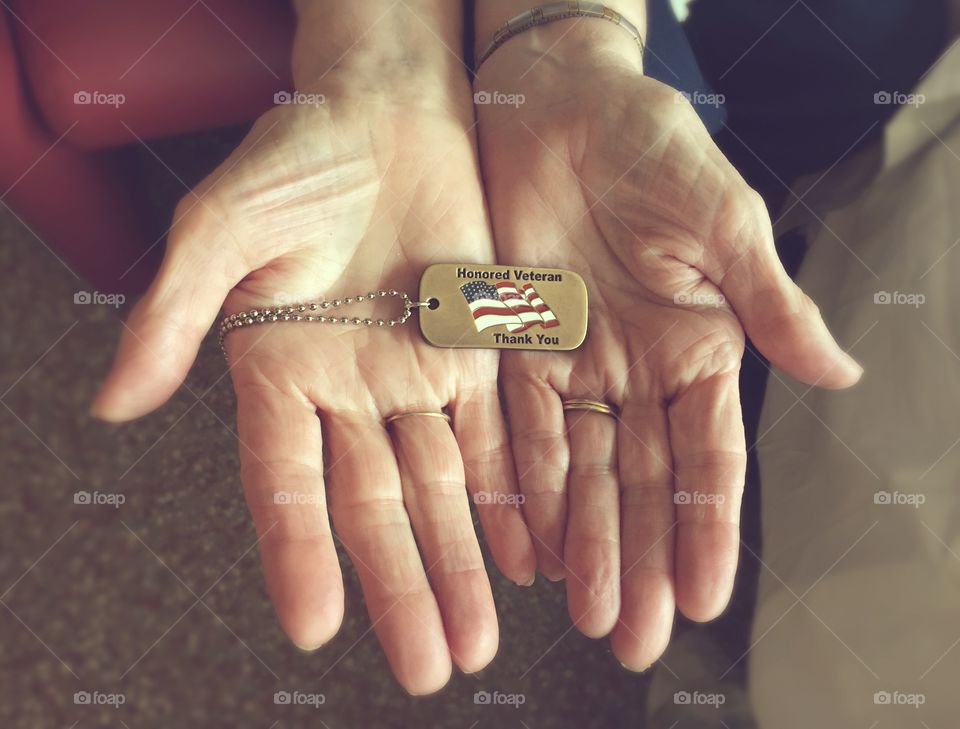 This sweet elderly woman was presented this dog tag from the hospital during the passing of her husband that served in WW2.