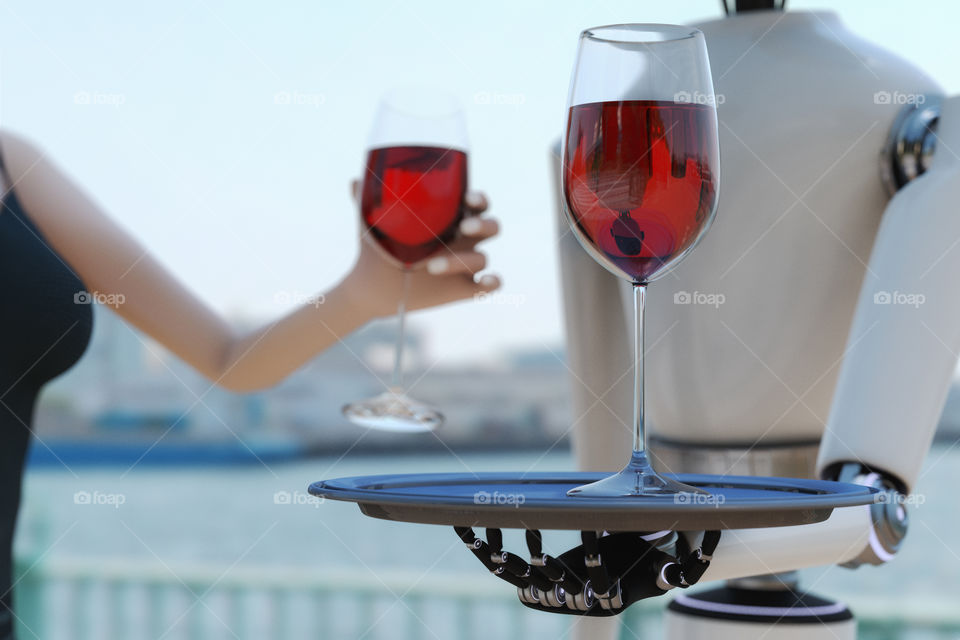 a robot serving red wine