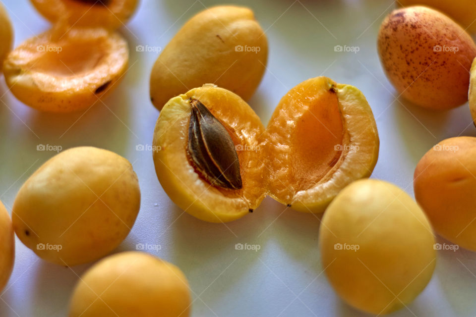 apricots lie on a white table
